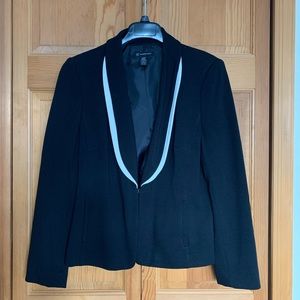 Black blazer with white detailing on lapel